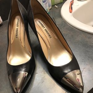 NWOT stilletos. Black with silver toe cap